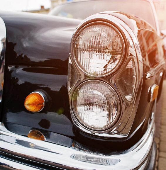 Retro car headlight. Front of old vintage car